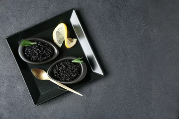  Bowls with black caviar on dark grey background © New Africa