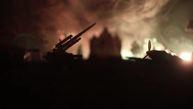 Slider shot. Retro World War 2 propelled model planes in possession.  Dark foggy light background. War scene. Useful for documentary.  Selective focus