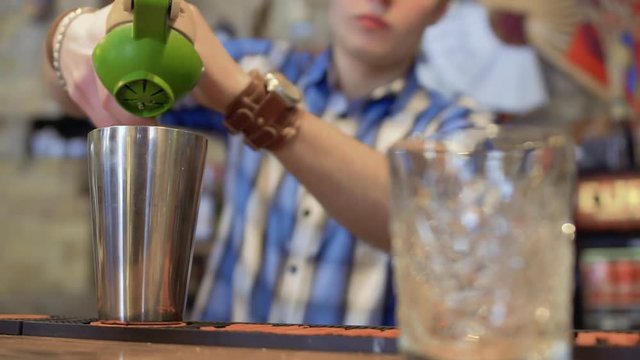 Barman squeeze fresh lemon juice for exotic cocktail
