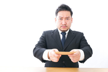 Businessman submitting a letter of resignation 