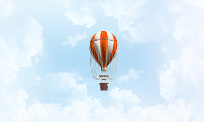 Flying hot air balloon in the air.