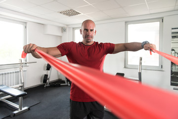 Man Exercising With a Resistance Band