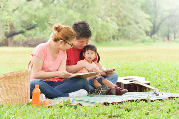 Happy Asian family having fun.