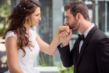 Romantic kiss and gaze into each others eyes, classy gentleman groom