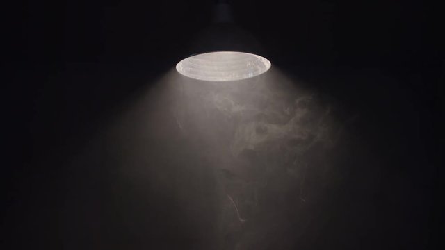 Hanging Swaying Lamp On Dark Room. Shot On Red Cinema Camera In Slow Motion.