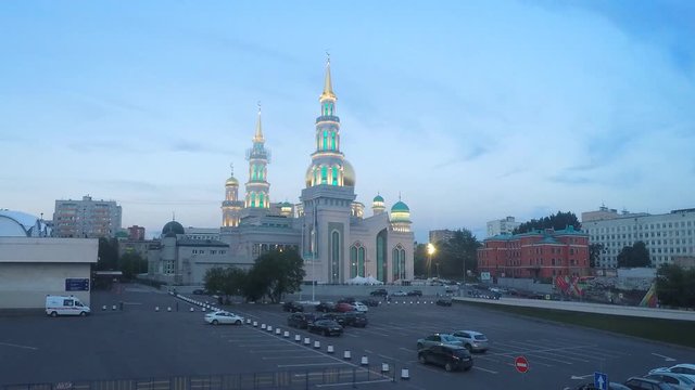 beautiful mosque with illumination in the city in the evening timelapse