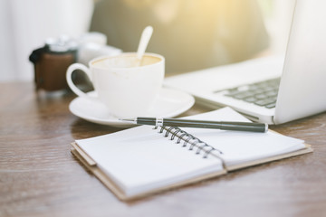 a cup of coffee latte has drank on wooden table