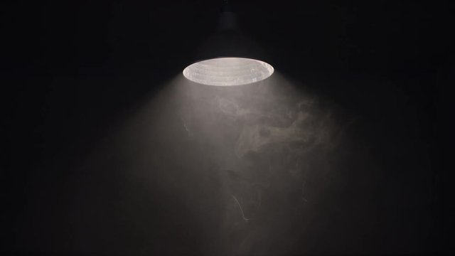 Hanging Swaying Lamp On Dark Room. Shot On Red Cinema Camera In Slow Motion.