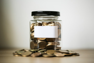 Coins In Glass Money Jar