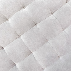 Gray buttoned fabric background