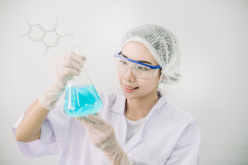 Professional distinguished Science specialist at work.Young Asian scientist with test tube making research in clinical laboratory.Innovative technologies in science and medicine