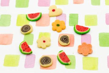 Colorful background, with sweets on the floor.