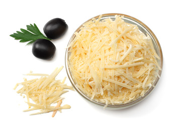 grated cheese with olives isolated on white background. top view