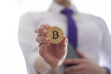 Business woman offers gold bitcoin coin. Digital Financial Bit Coin ICO Technology.