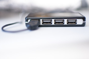 USB port on a white table against the background of wires