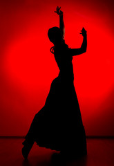 silhouette of spanish girl flamenco dancer on a red background - obrazy, fototapety, plakaty