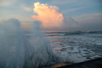 Fototapeta na wymiar Storm surge at sunset in Bali