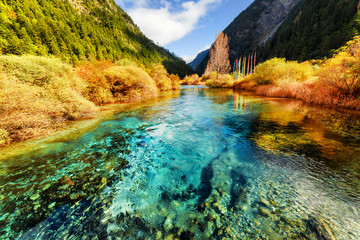 Beautiful azure crystal clear water of river in mountains