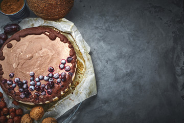 Chocolate vegan cake with different nuts, dates and carob