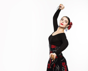 spanish girl flamenco dancer on a light background. free space for your text