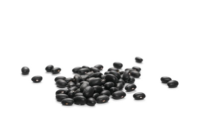 Pile organic black beans, isolated on white background