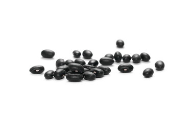 Pile organic black beans, isolated on white background