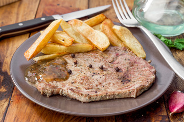 grilled beef steak with chips