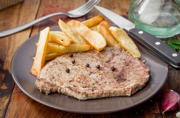 grilled beef steak with chips