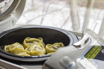 Uzbek mantas cooked in a double boiler, front and back are blurred