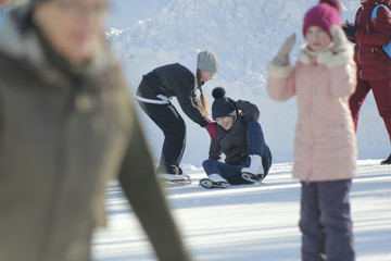 Girls Teens having fun at winter skate ring