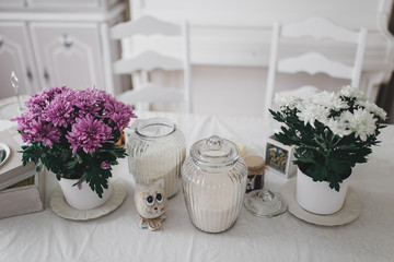 Fototapeta na wymiar Flowers on the white table cloth