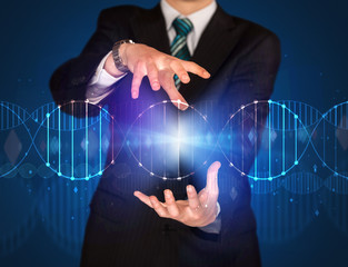 Businessman holding DNA