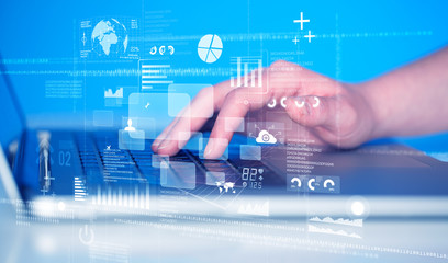 Keyboard buttons pressed by hand with high tech icons