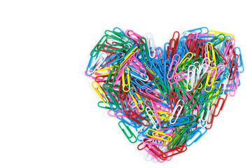Series of colorful paper clips on a white background with copy space.