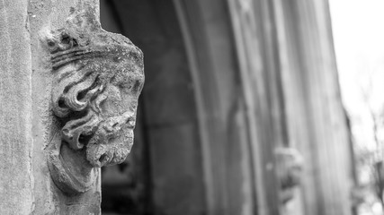 Corbel Head on St John Church in Bristol A, Architecture Details, black and white shallow depth of field horizontal photography