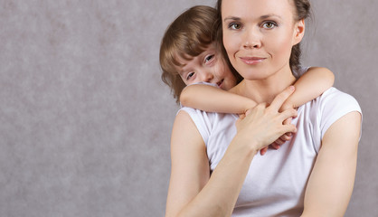 Young mother with her 3 years old son.