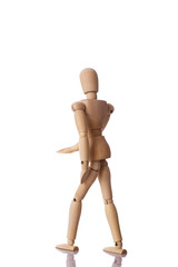 Wooden model walking isolated on a white background.