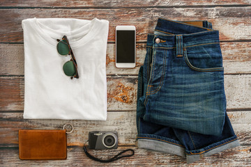 Traveler items vacation travel accessories for holiday or long weekend Simple Denim style Vintage Classic Hipster Look Clothing Overhead  view choice guide idea for planning travel around the world  