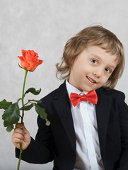 Small boy of four years with a rose.