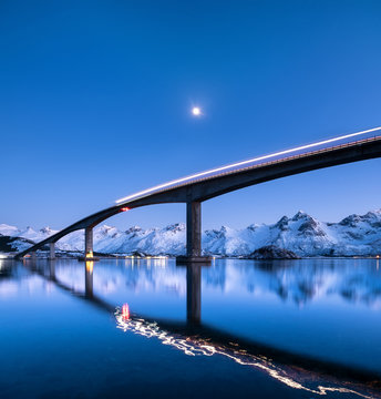 Bridge and reflection on the water surface. Natural landscape in the Norway
