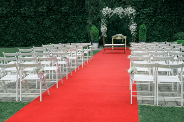 Beautiful Wedding ceremony decoration, rustic altar decorated with lilies, alstroemerias and...