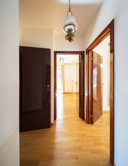 Anteroom with three doors, two rooms and a window.