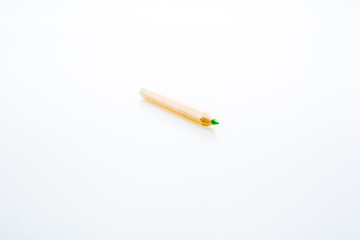 Wooden color pencils isolated on a white background. Concept of knowledge and education