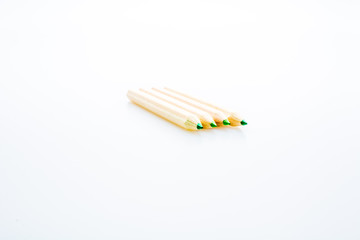 Wooden color pencils isolated on a white background. Concept of knowledge and education
