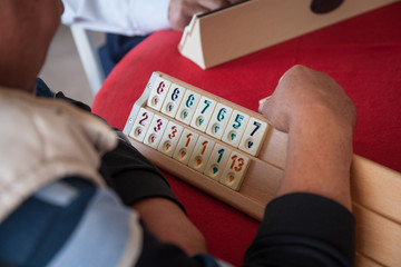 People play  popular logic table game rummikub