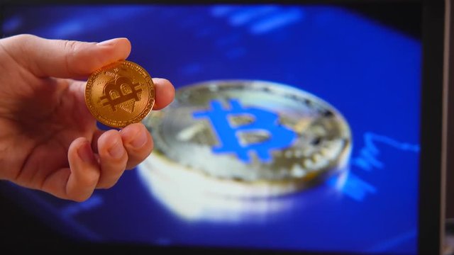 Trade in the house crypto currency. Close-up of a smartphone and coins of Litecoin LTC, BitCoin BTS, Ethereum ETX, and Ripple, XRP