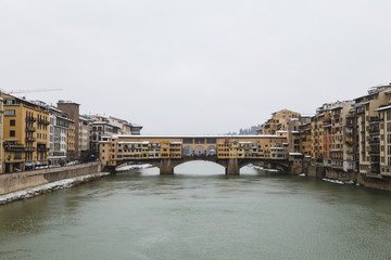 Fototapeta na wymiar Ponte Vecchio, Florence. Snow over the famous bridge