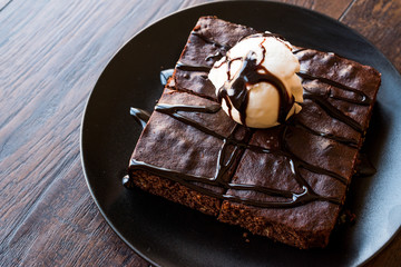 Chocolate Brownie with Ice Cream and Hazelnut Powder.
