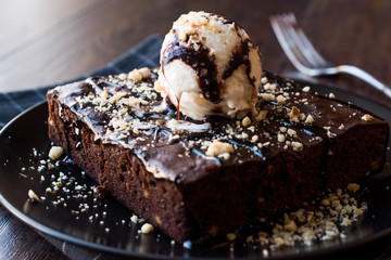 Chocolate Brownie with Ice Cream and Hazelnut Powder.