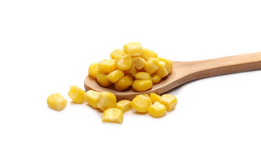 Yellow cooked corn in wooden spoon isolated on white background, for popcorn